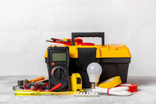 istock Electrician equipment on background with copy space.Top view.Electrician tool set.Multimeter, tester,screwdrivers,wire pliers,duct tape, lamps, tape measure and wires.Flet lay. 1690963761