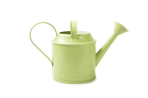 Green watering can for watering plants isolated on white background.