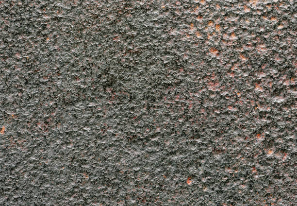 Old damaged metal surface with dents and potholes, rough texture