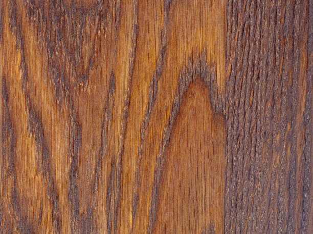 istock Detailed wood grain close-up, dark oak background 1690974420