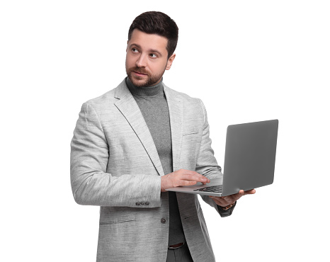 Handsome bearded businessman using laptop on white background
