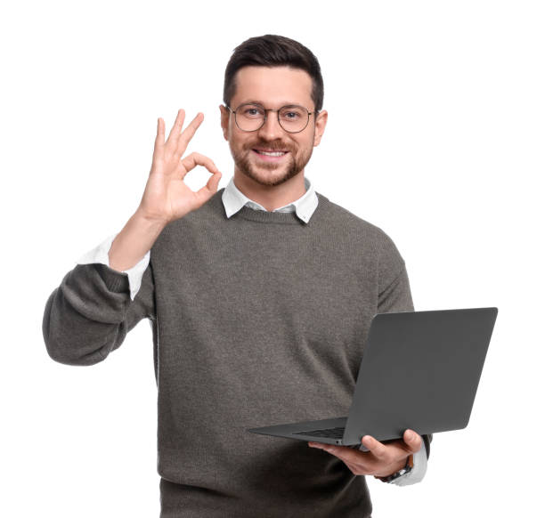 istock Handsome bearded businessman with laptop showing OK gesture on white background 1690984598