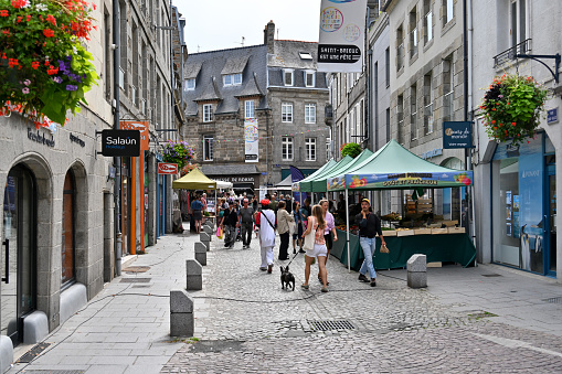 Saint-Brieuc, France, August 23, 2023 - People in a shopping street in the old town of Saint-Brieuc, Bretgane