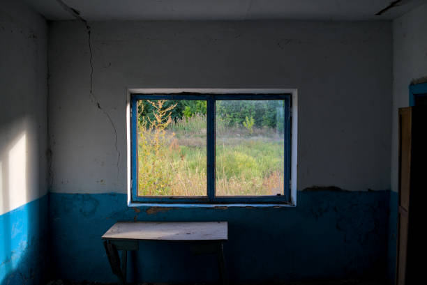 istock Room with a broken window in the building 1690992527