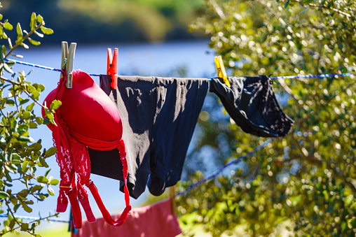 Clothes hanging to dry on laundry line outdoors. Camping on holidays trip