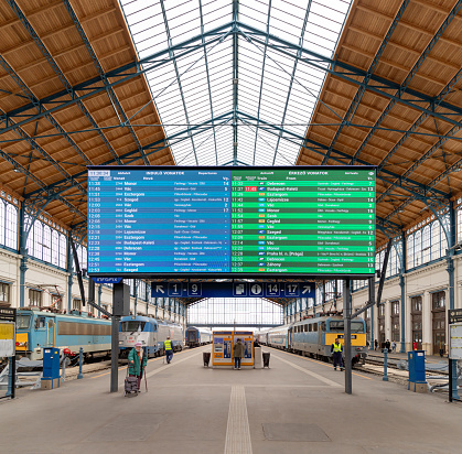 Budapest, Hungary - April 24, 2023: A picture of the Nyugati train station with a large timetable screen on display.