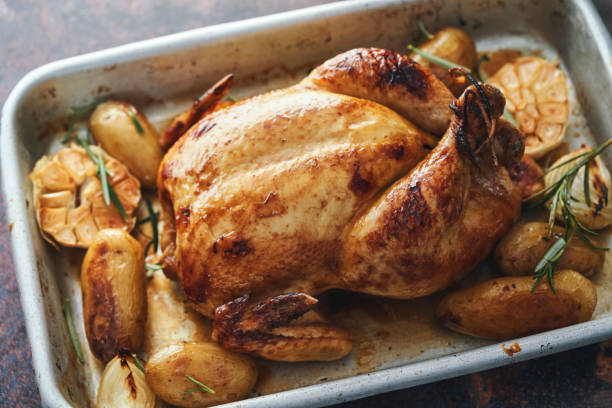 istock Roasted Chicken with Root Vegetables in Domestic Kitchen 1691004763
