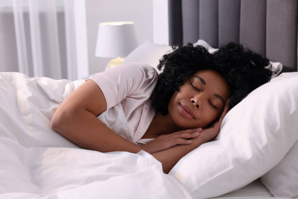 istock Beautiful young woman sleeping in soft bed at home 1691017165