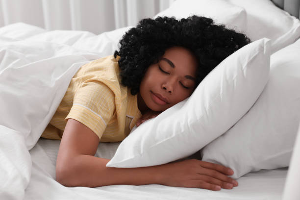 istock Beautiful young woman sleeping in soft bed 1691017958