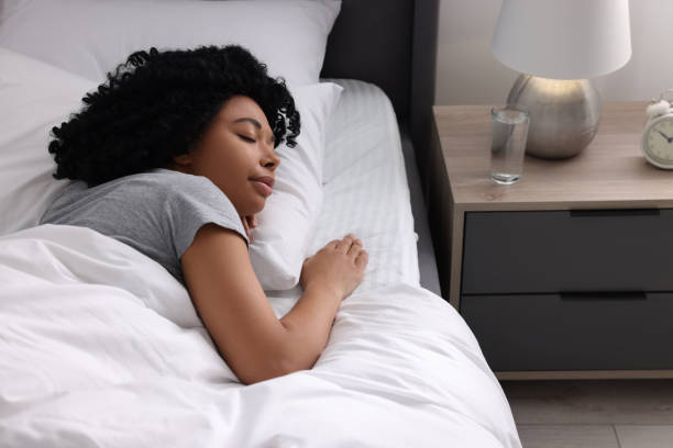 istock Beautiful young woman sleeping in soft bed at home 1691018124