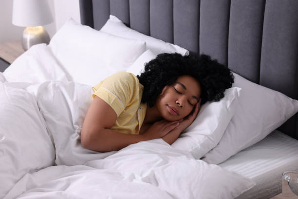 istock Beautiful young woman sleeping in soft bed at home 1691018262