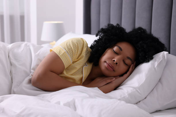 istock Beautiful young woman sleeping in soft bed at home 1691018274