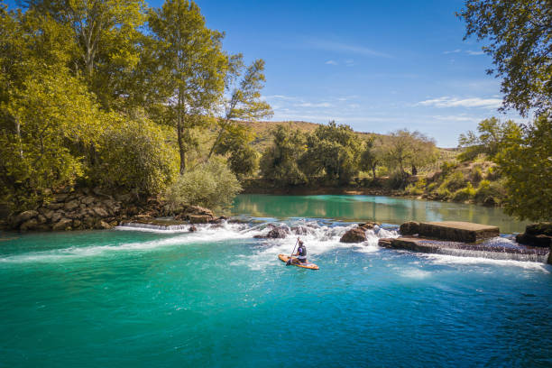 istock Stand-up paddling on a river 1691033153