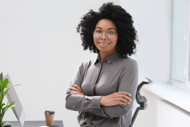 istock Smiling young businesswoman in her modern office 1691034211