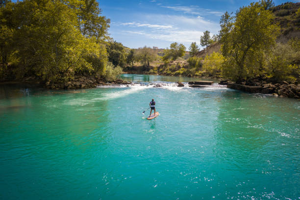 istock Stand-up paddling on a river 1691038259