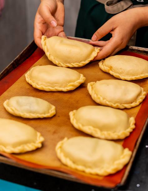 istock the lady is making small pieces of pastries on the baking sheet 1691038300
