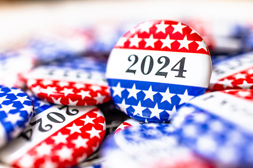 Closeup of new election vote button with text that says 2024