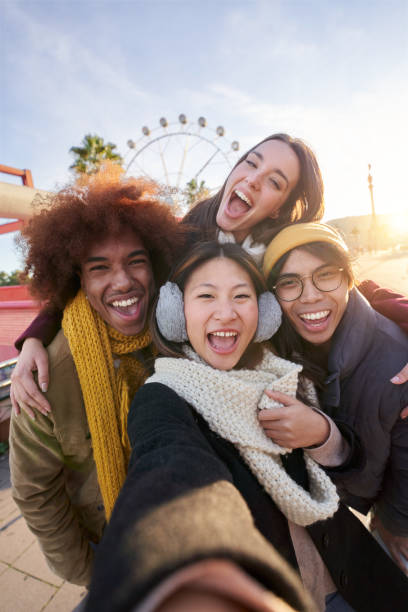 istock Vertical excited smiling group multiracial friends taking funny selfie looking smiling at camera. 1691054607