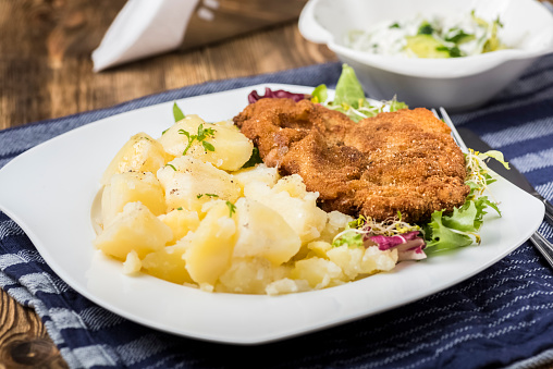 pork chop traditional Polish dish with cucumber salad