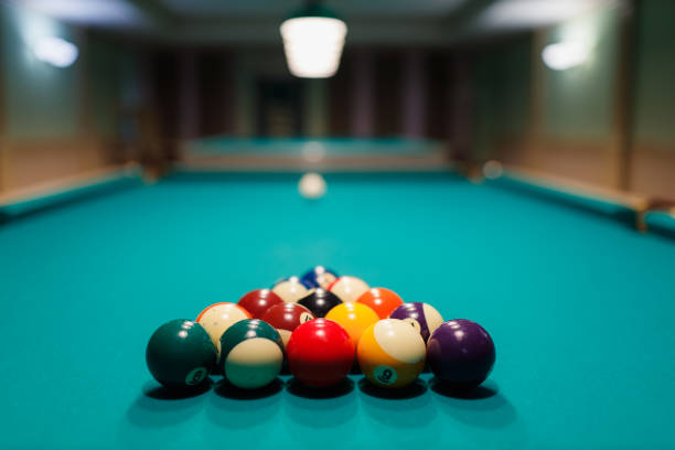 istock Billiard accessories balls and cue on a billiard table 1691061837