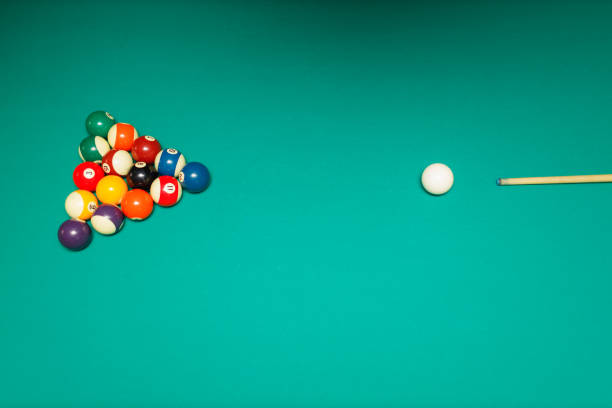 istock Billiard accessories balls and cue on a billiard table 1691062029