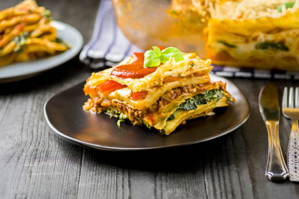 homemade lasagna with minced meat, spinach and tomatoes