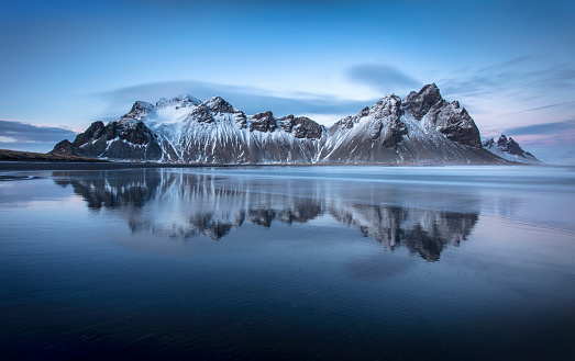 The spectacular Vesterhorn mountains rise out of the sea in South-Eastern Iceland