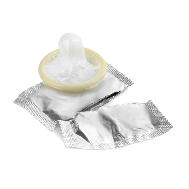 istock Torn package with condom isolated on white. Safe sex 1691069359