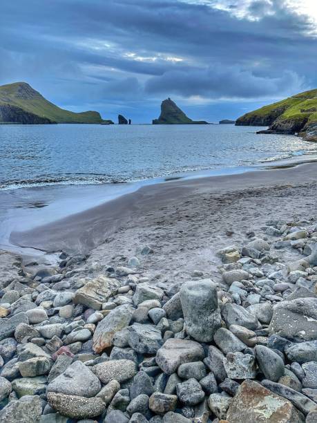 istock Pebble beach in the Faroe Islands and islets in the background 1691076604