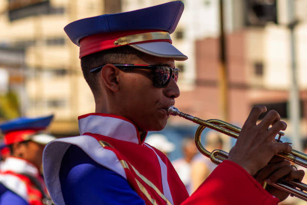 Goiânia, Goias, Brazil – September 07, 2023: A boy playing a wind instrument during the civic-military parade on September 7th, Brazilian Independence Day.