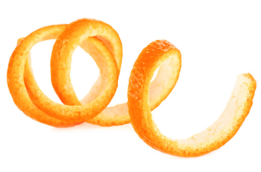 Single fresh orange peel on a white background. Vitamin C, skin health beauty concept.