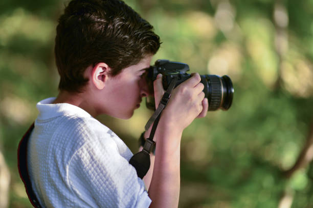 istock little photographer walking in the forest 1691103589