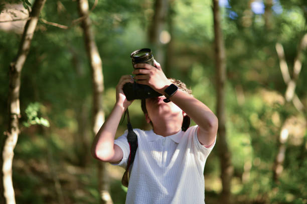 istock little photographer walking in the forest 1691107358