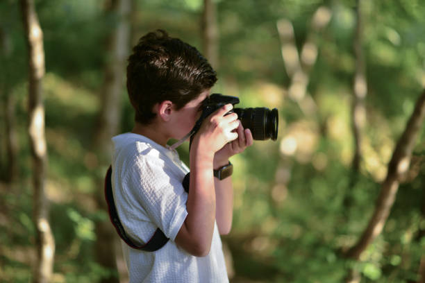 istock little photographer walking in the forest 1691107363