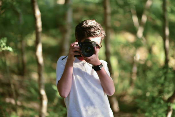 istock little photographer walking in the forest 1691107366