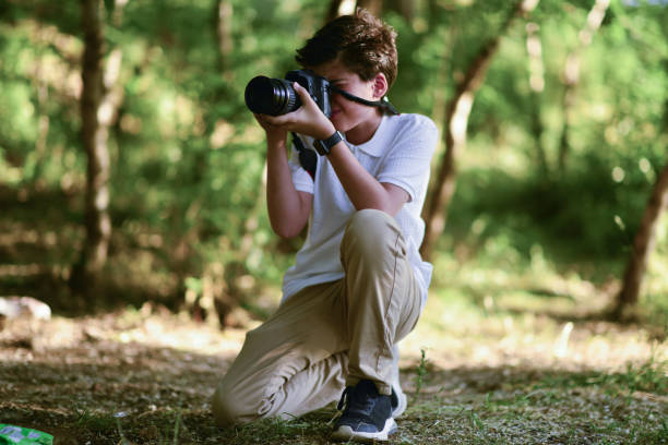 istock little photographer walking in the forest 1691108585