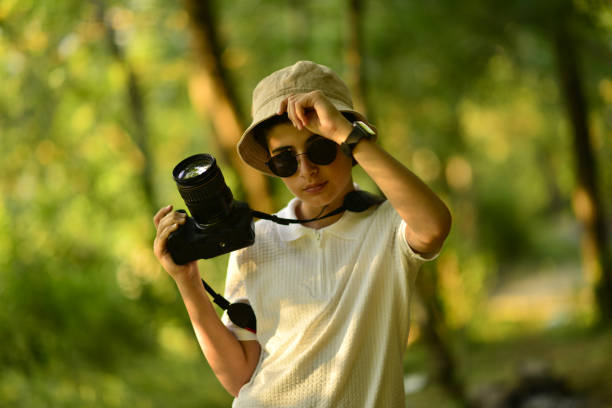 istock little photographer walking in the forest 1691110180