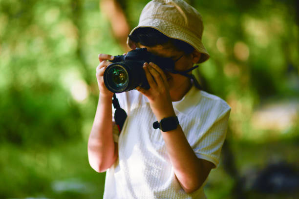 istock little photographer walking in the forest 1691110181