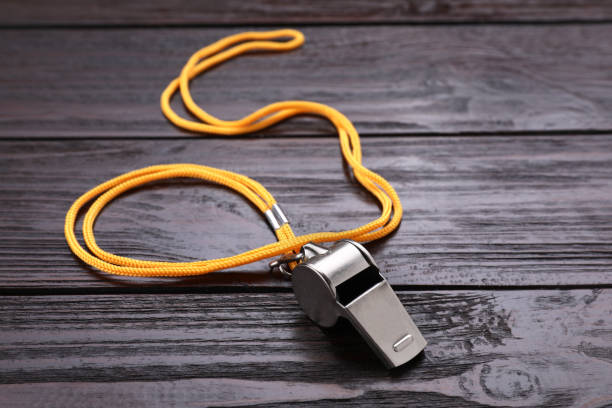 istock One metal whistle with cord on wooden table 1691136329