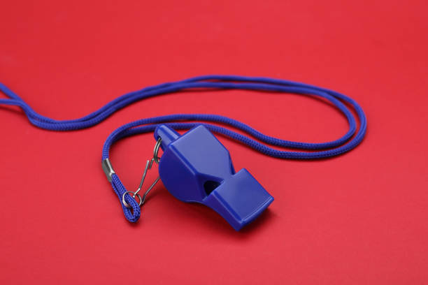 istock One blue whistle with cord on red background 1691136393
