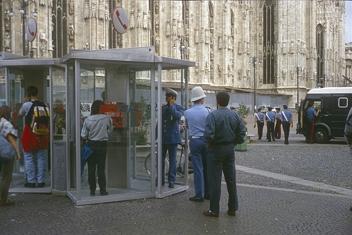 Milan, Lombardy, Italy, 1976. Police officers gather in front of the Milan Cathedral. Also: tourists and Milan residents.