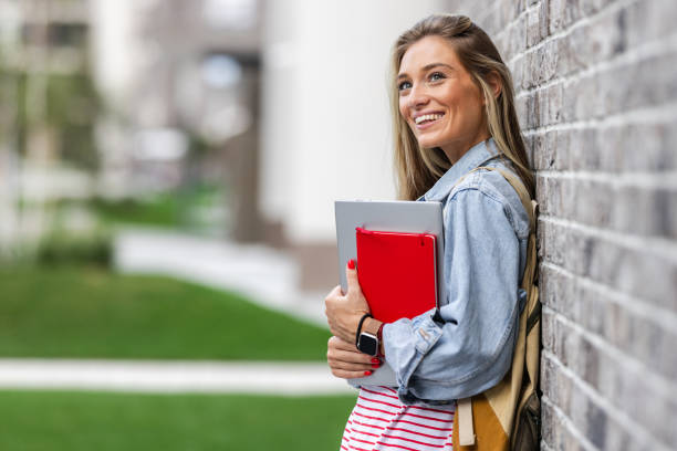 istock Academic Pursuit. Beautiful young woman with books 1691150930
