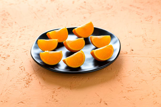 tangerine juicing in pieces on a plate