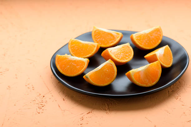 istock tangerine in pieces on a plate 1691168070