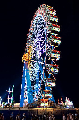 Theresienwiese, Munich, Bavaria, Germany, 2023, Oktoberfest, Wiesn, view at night from an side angle at the large ferris wheel