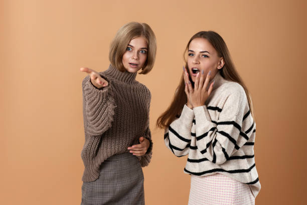 istock Two cheerful attractive women friends talking together 1691180012