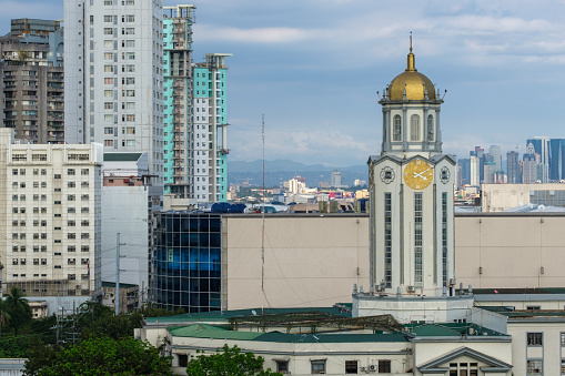 Manila, The Philippines - March 18, 2023: An arial photo of Manila, The Philippines featuring the Manila City Hall Clock Tower with it's gold clock and dome.