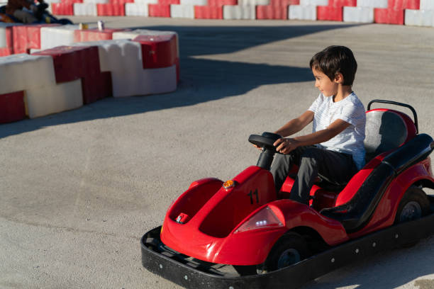 istock boy driving a battery-powered vehicle in a gokart 1691217304