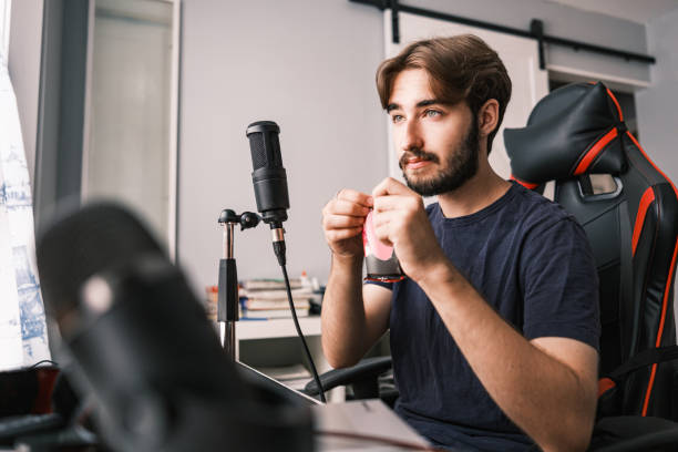 istock Young Caucasian man streaming with friends online 1691217312