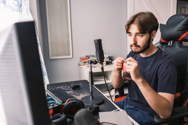 istock Young Caucasian man streaming with friends online 1691217314